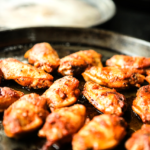 a plate of chicken wings