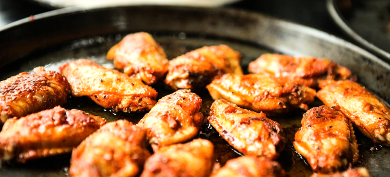 a plate of chicken wings